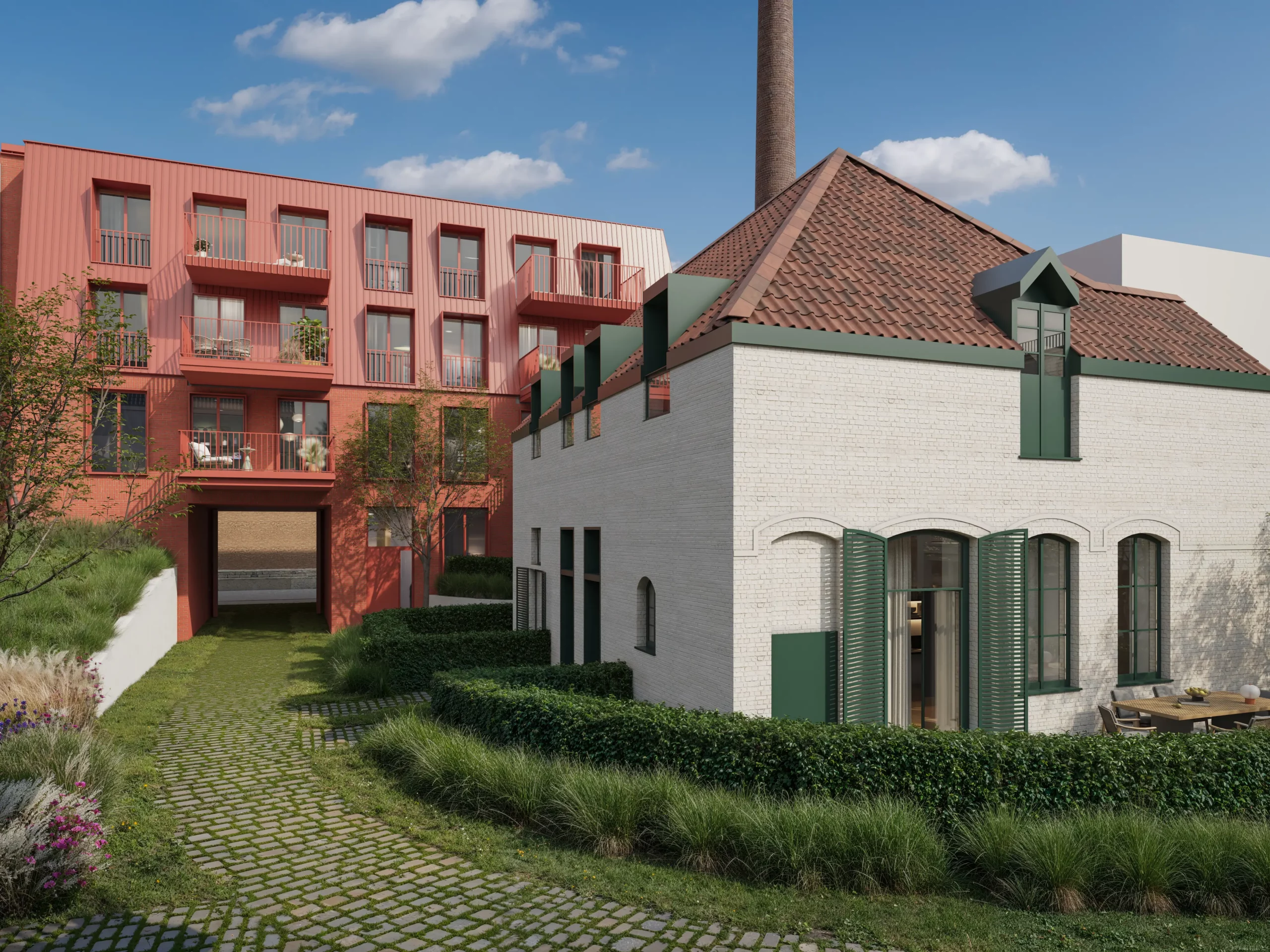 Binnentuin met het witte brouwershuis en de bakstenen appartementsgebouwen van Residentie De Brouwerij
